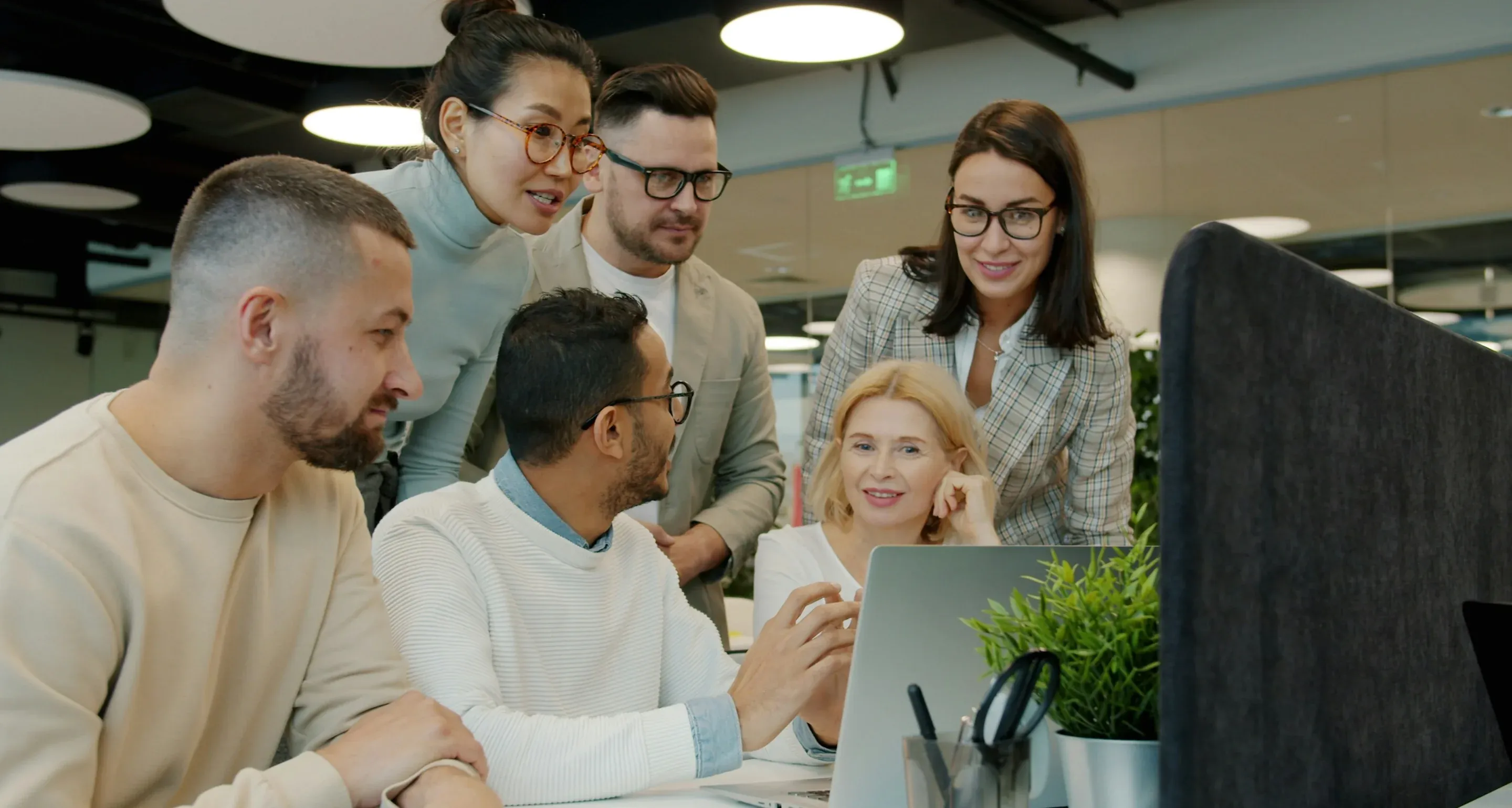 The team reviews the results together on a laptop at the office